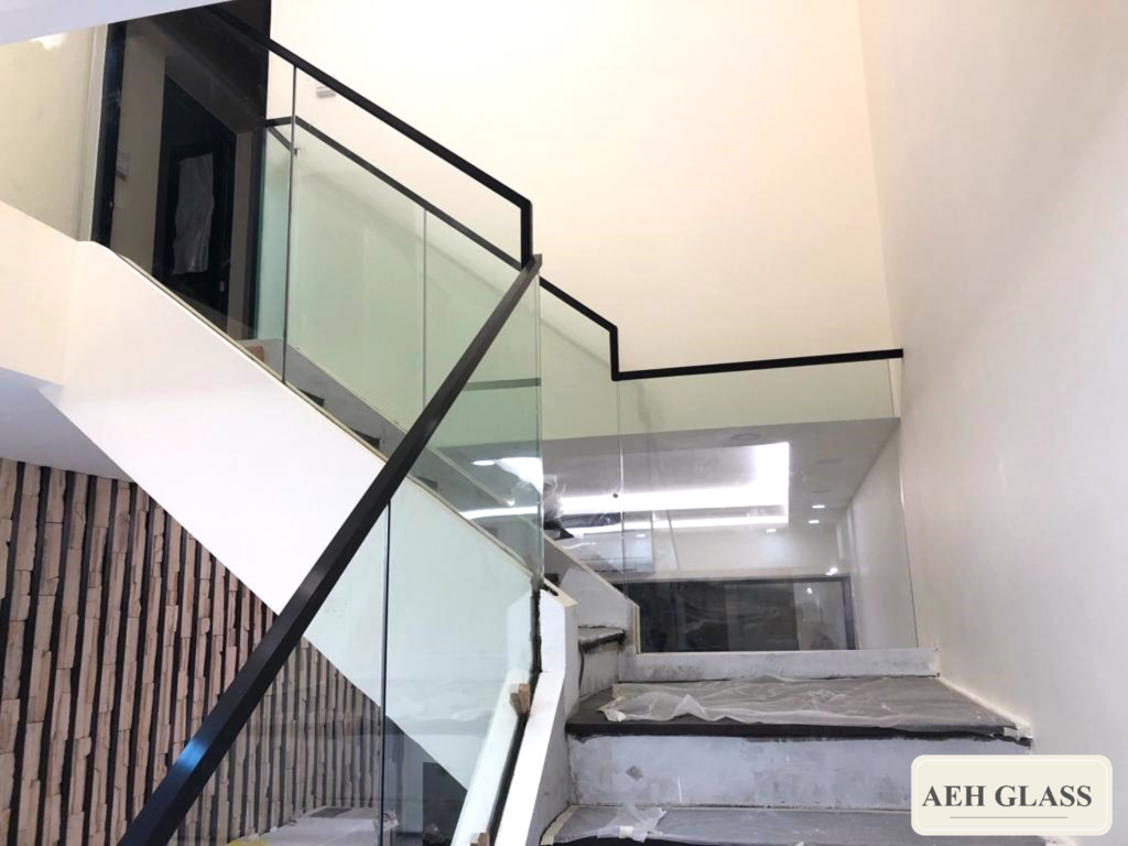 Glass staircase with black capping